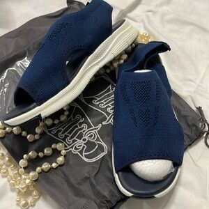 Blue sandals. Very lightweight. Medium width. Stretchy fabric.